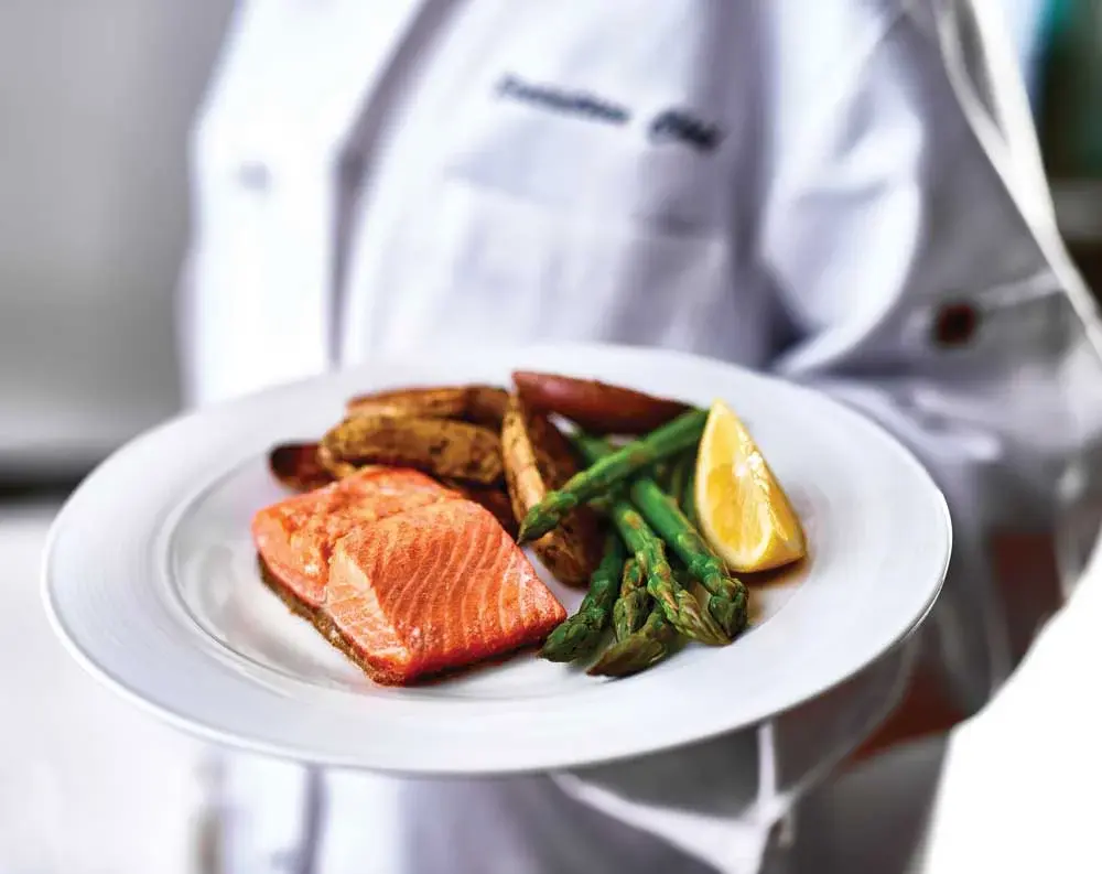 Shads Landing Chef Created Meals, chef delivering a finished dish.